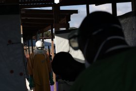 A Medecins Sans Frontieres (MSF) worker is sprayed and disinfected as he leaves a high risk zone of MSF's Ebola isolation and treatment center in Monrovia, Liberia, Sept. 29, 2014. Jerome Delay—AP